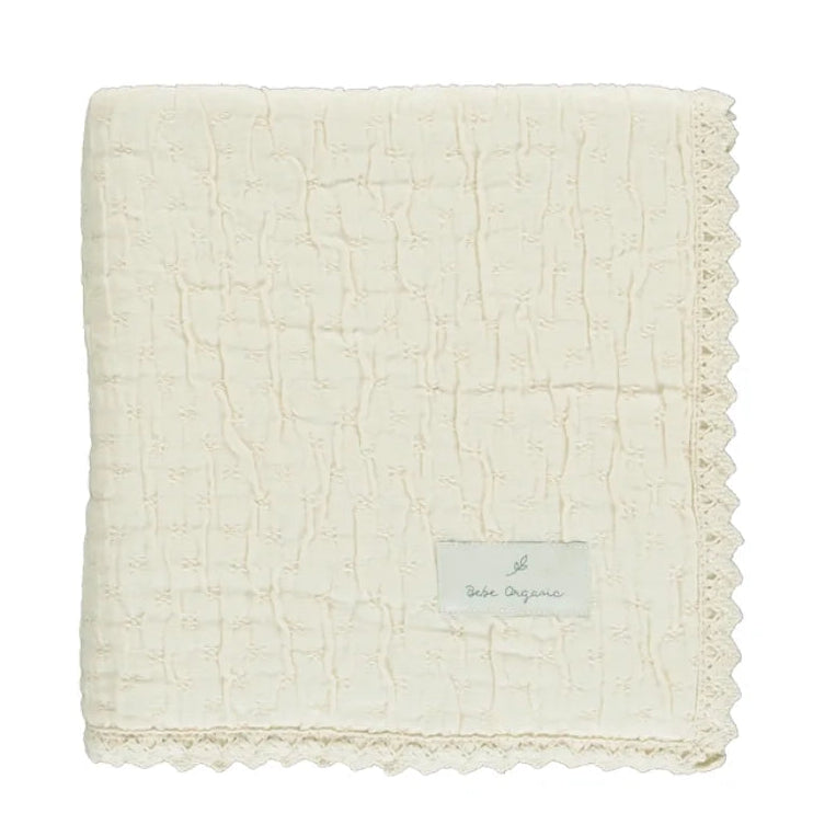 A neatly folded presentation showcasing the plush chenille texture natural
