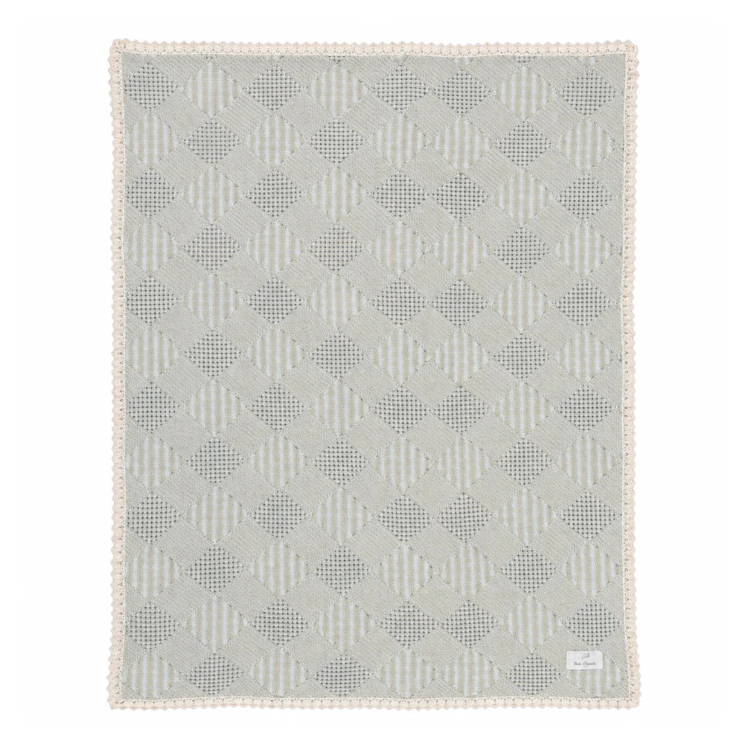 A front view of the Bebe Organic taupe plaid patchwork organic cotton baby blanket.