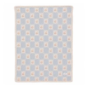 A front view of the Bebe Organic rocking horse patchwork organic cotton baby blanket blue