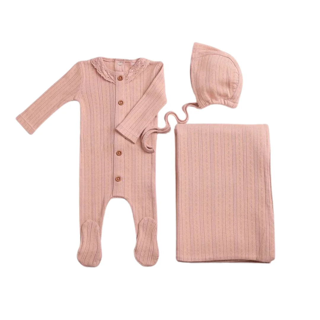A front view of the elegant misty rose Bee & Dee crochet pointelle footie and bonnet set.