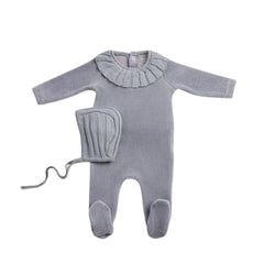 A front view of the elegant ocean blue Bee & Dee Pleated Knit footie and bonnet.