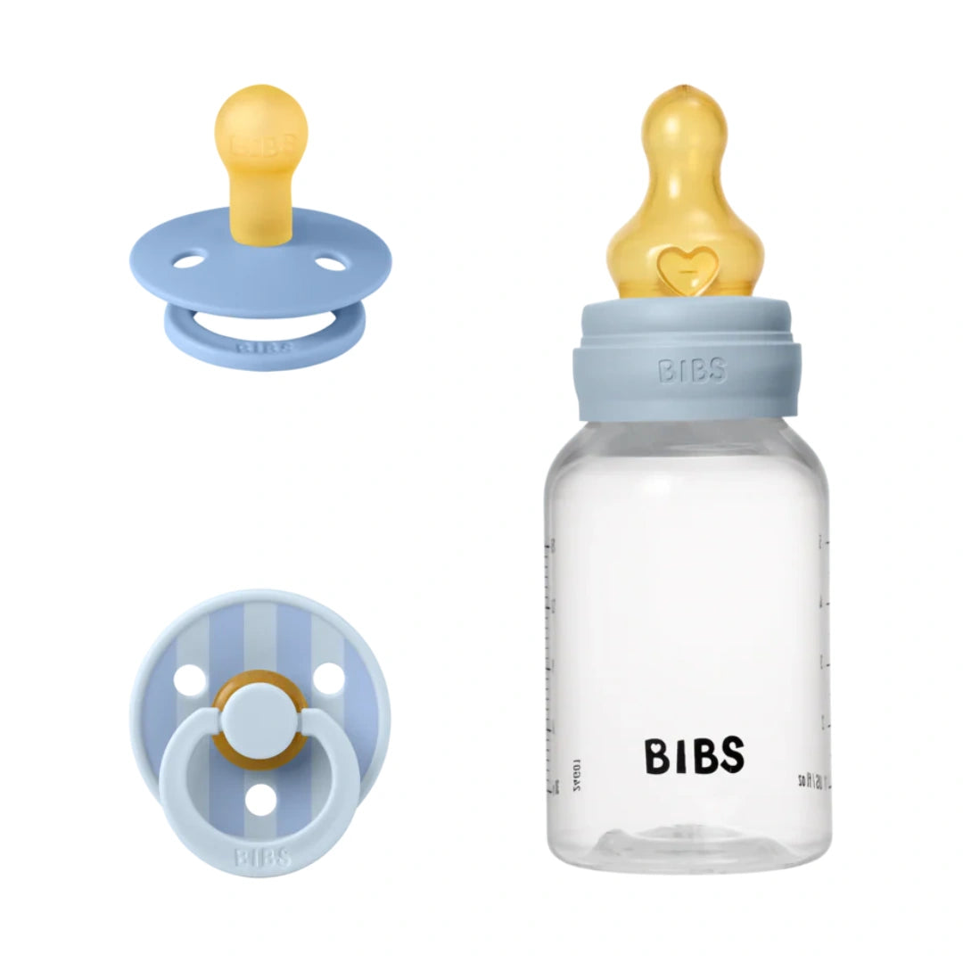 BIBS baby bottle and pacifiers with blue and yellow design on a white background