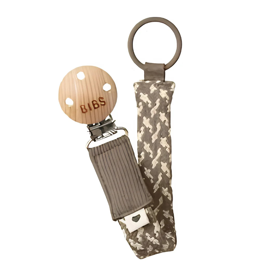 BIBS pacifier clip with camouflage strap on a white background