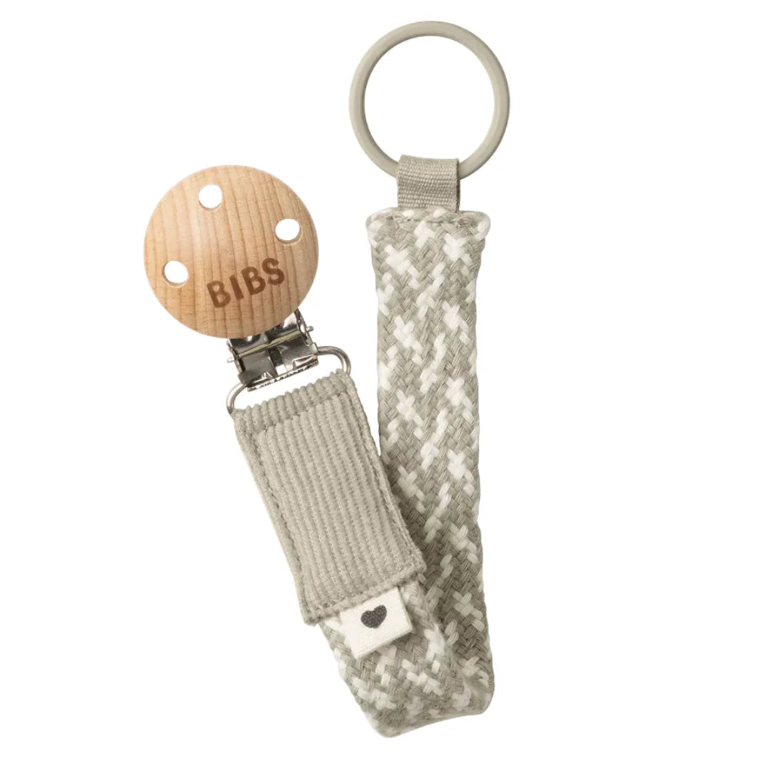 BIBS wooden pacifier clip with textured fabric strap on a white background