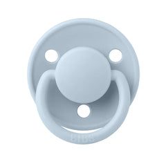 A breathtaking BIBS De Lux Silicone Pacifier in Baby Blue, showcasing its immaculate minimalist shield and premium clear silicone nipple.