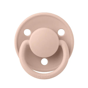 A breathtaking BIBS De Lux Silicone Pacifier in Blush, showcasing its immaculate minimalist shield and premium clear silicone nipple.