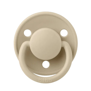 A breathtaking BIBS De Lux Silicone Pacifier in Vanilla, showcasing its immaculate minimalist shield and premium clear silicone nipple.