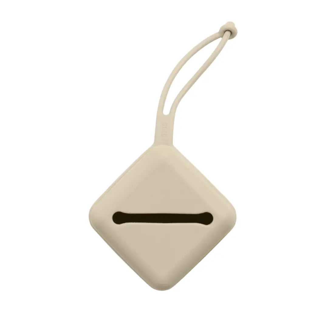 A breathtaking BIBS Pacifier Case in a warm Vanilla tone, showcasing its immaculate minimalist design and silicone attachment strap.