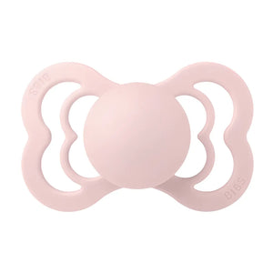 Pink BIBS baby pacifier on a white background