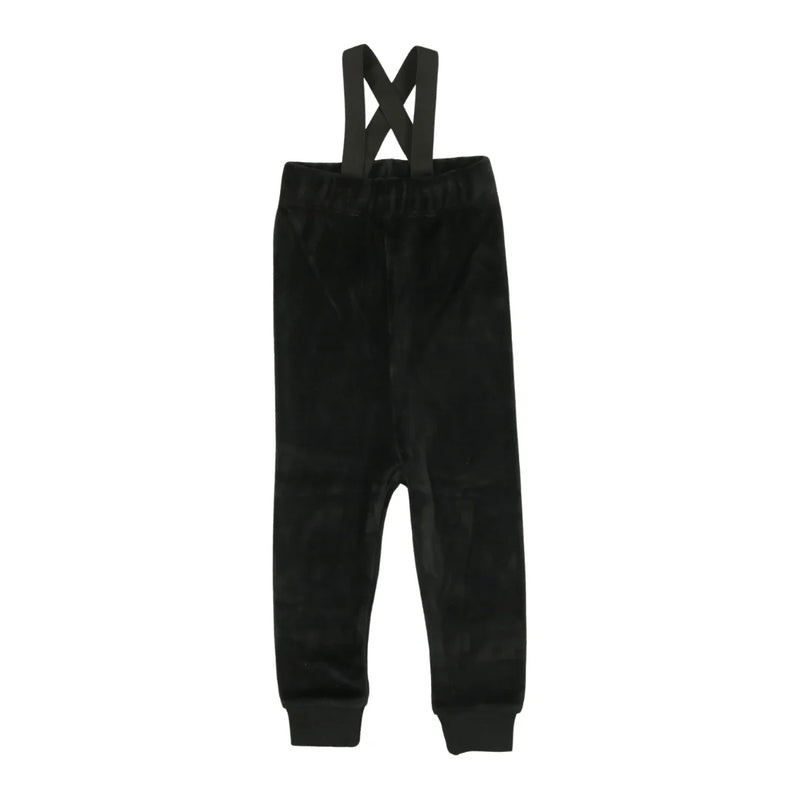 A front view of the Bopop black velour overalls for boys.