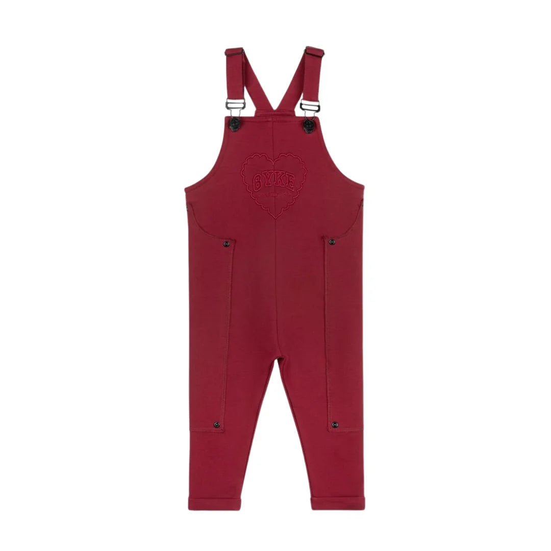 A front view of the Byke cranberry patch knit baby romper.