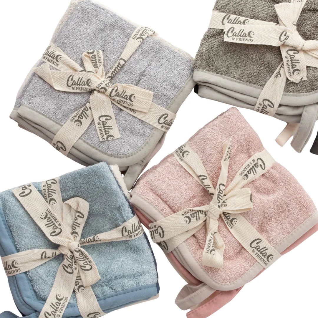 Four folded towels in gray, pink, blue, and beige with 'Callio' branding on a white background.