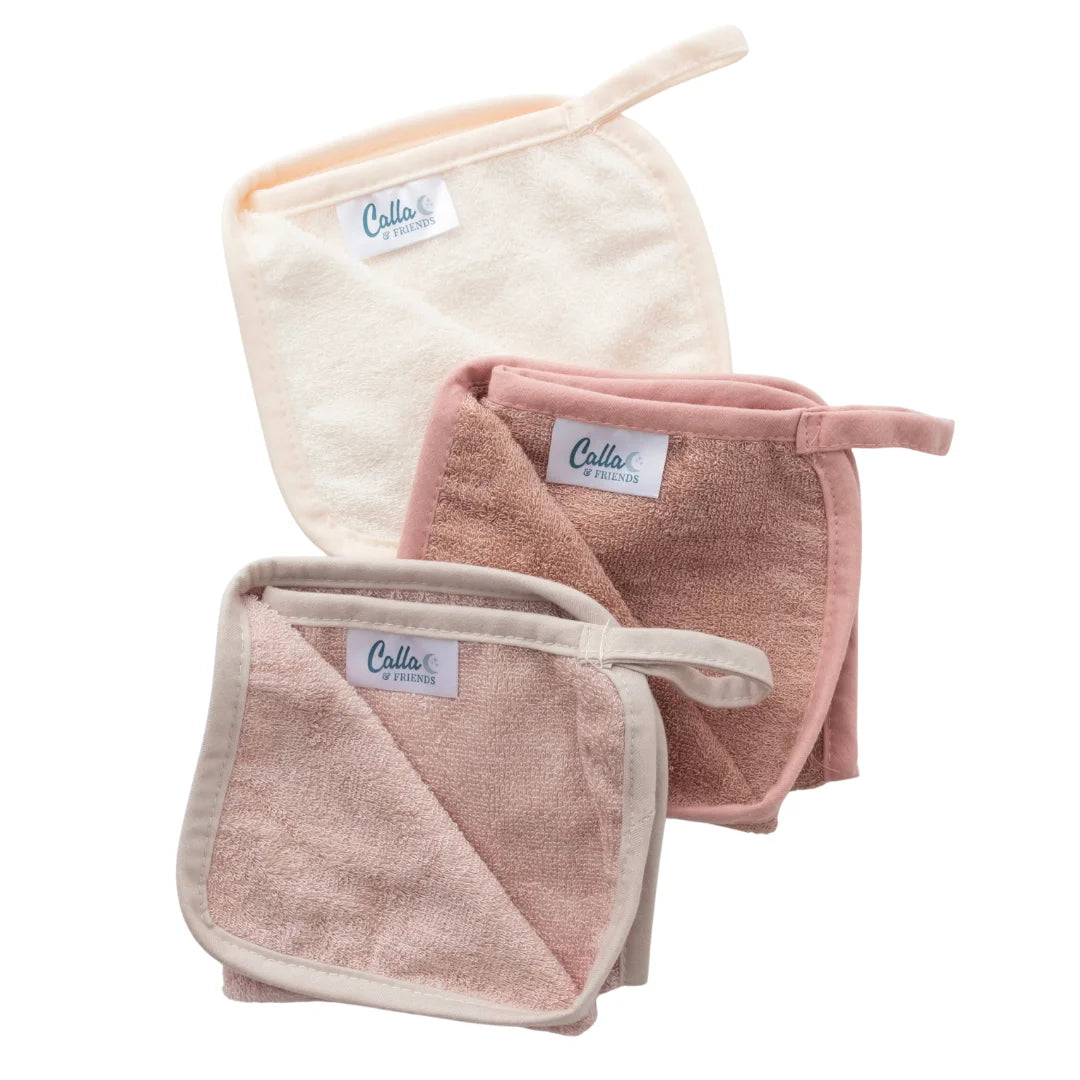 Set of three soft towels with 'Cala' branding on a white background