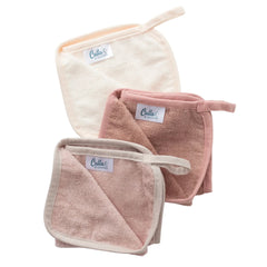 Set of three soft towels with 'Cala' branding on a white background