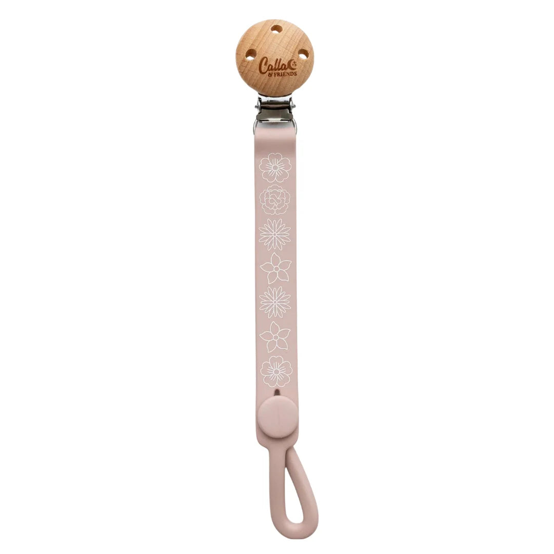 Pacifier clip with wooden ball and floral design on a white background