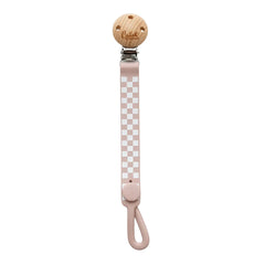 A breathtaking Calla & Friends Nash Everything Clip featuring an immaculate petal pink checkered pattern, designed to secure pacifiers and soothe teething gums.