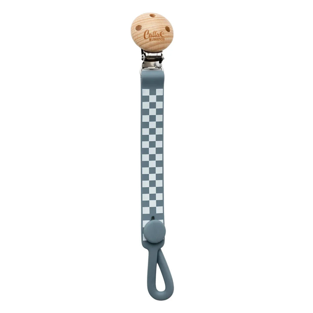 A breathtaking Calla & Friends Nash Everything Clip featuring an immaculate slate blue checkered pattern, designed to hold pacifiers and soothe teething gums.
