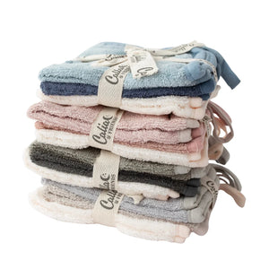 Stack of folded baby socks with a visible brand label on a white background