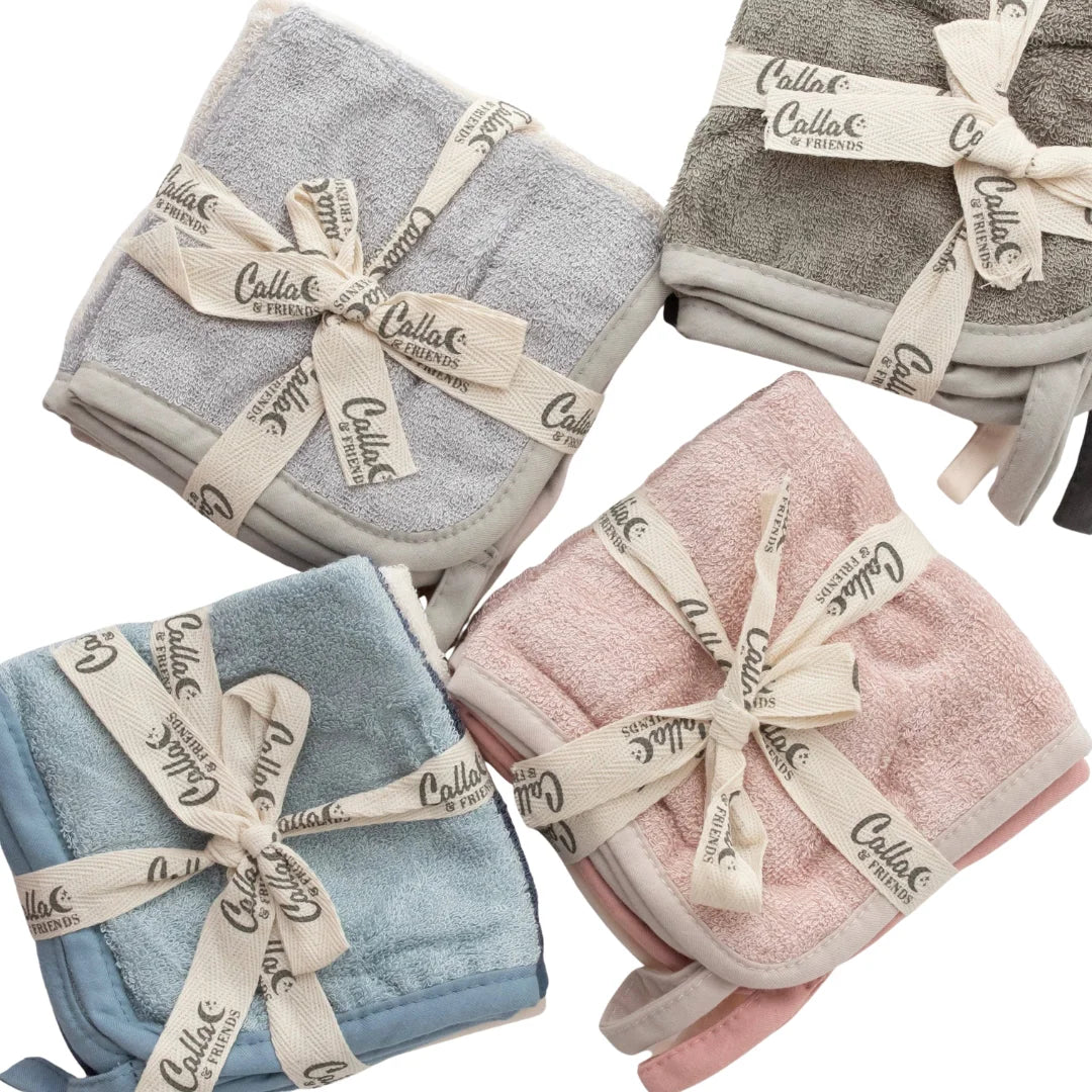 Four folded towels in gray, pink, blue, and white with 'Callio' branding.