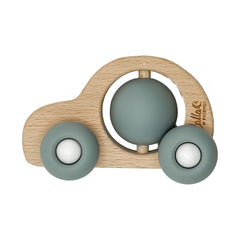Wooden toy car with green spheres on a white background