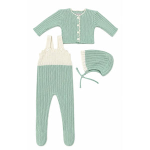 Knitted baby outfit with cardigan, romper, and bonnet on a white background