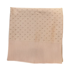 A breathtaking Carmina baby blanket featuring an immaculate anemone floral motif and a cozy, premium drape.