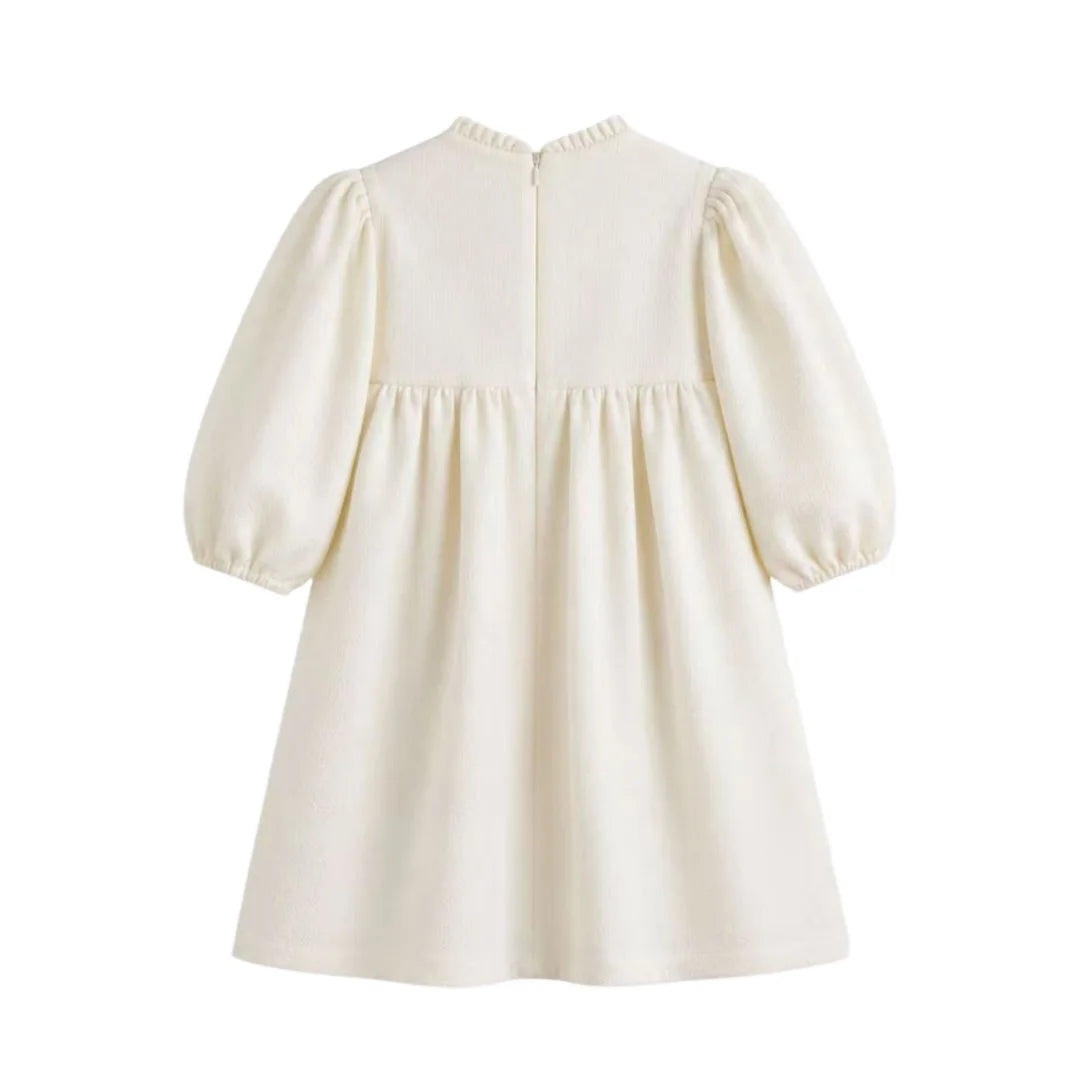 Clean back view of the cream C’era Una Volta Brigitte long-sleeve boutique dress for baby girls