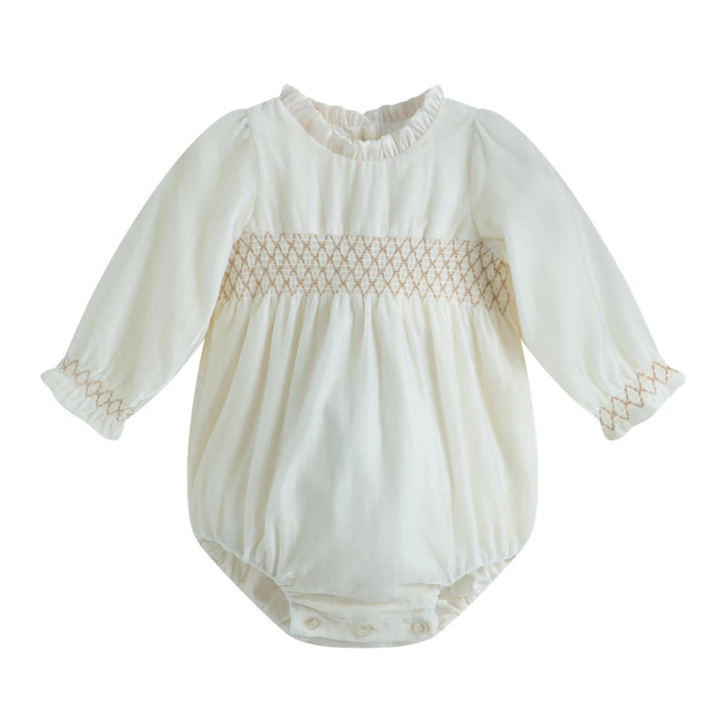 White baby romper with lace details on a white background