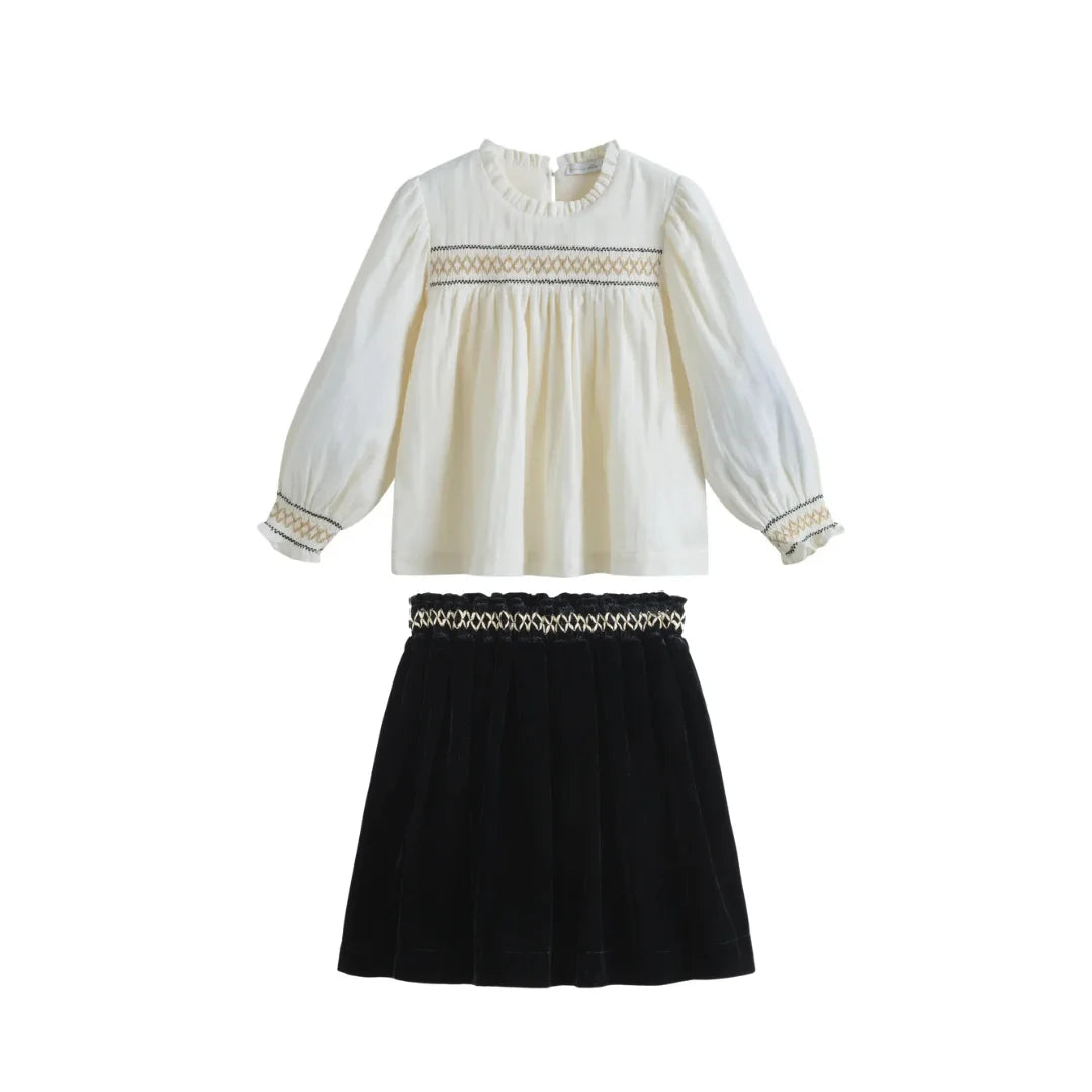 A front view of the sophisticated C'era Una Volta Rosa skirt and Megan shirt ensemble.