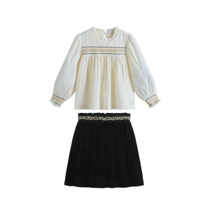 A front view of the sophisticated C'era Una Volta Rosa skirt and Megan shirt ensemble.
