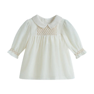 White blouse with lace details on a white background