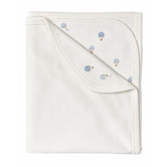 A flat-lay view of the Coton Pompom Dreamy Air Balloons corduroy blanket in ivory.