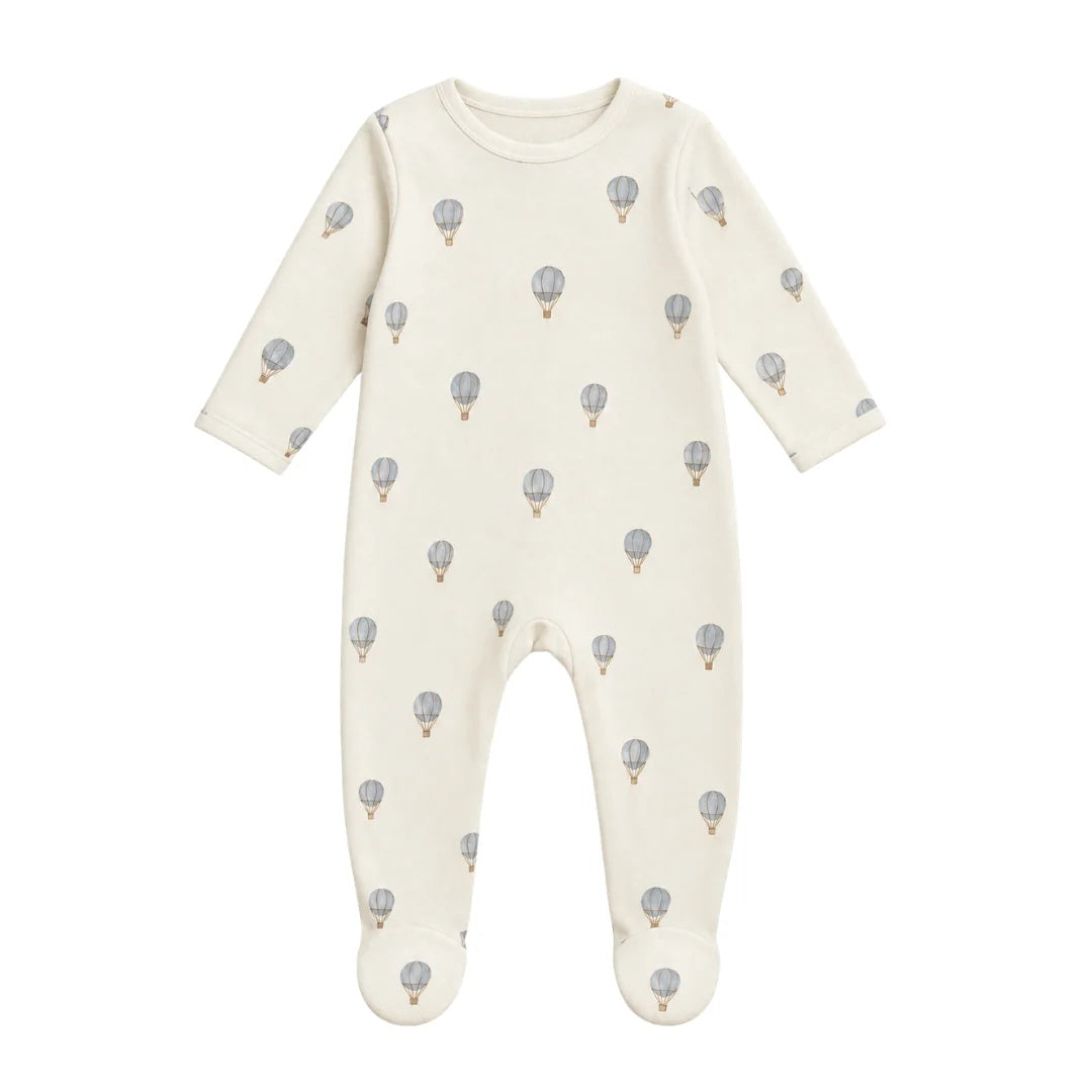 A flat-lay view of the Coton Pompom dreamy air balloons footie in ivory.