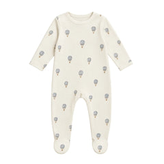 A flat-lay view of the Coton Pompom dreamy air balloons footie in ivory.