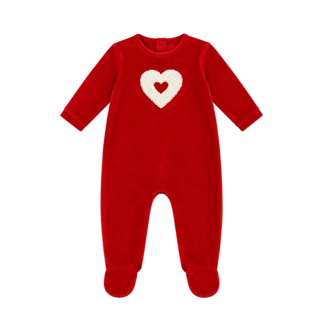 A flat-lay view of the Coton Pompom embrace heart footie in red.