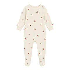 A flat-lay view of the Coton Pompom mini cherries footie in ivory.