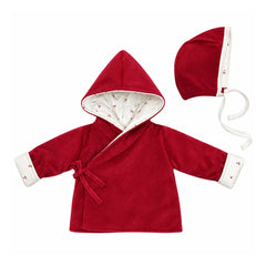 A flat-lay view of the Coton Pompom mini cherries jacket and bonnet set in red.