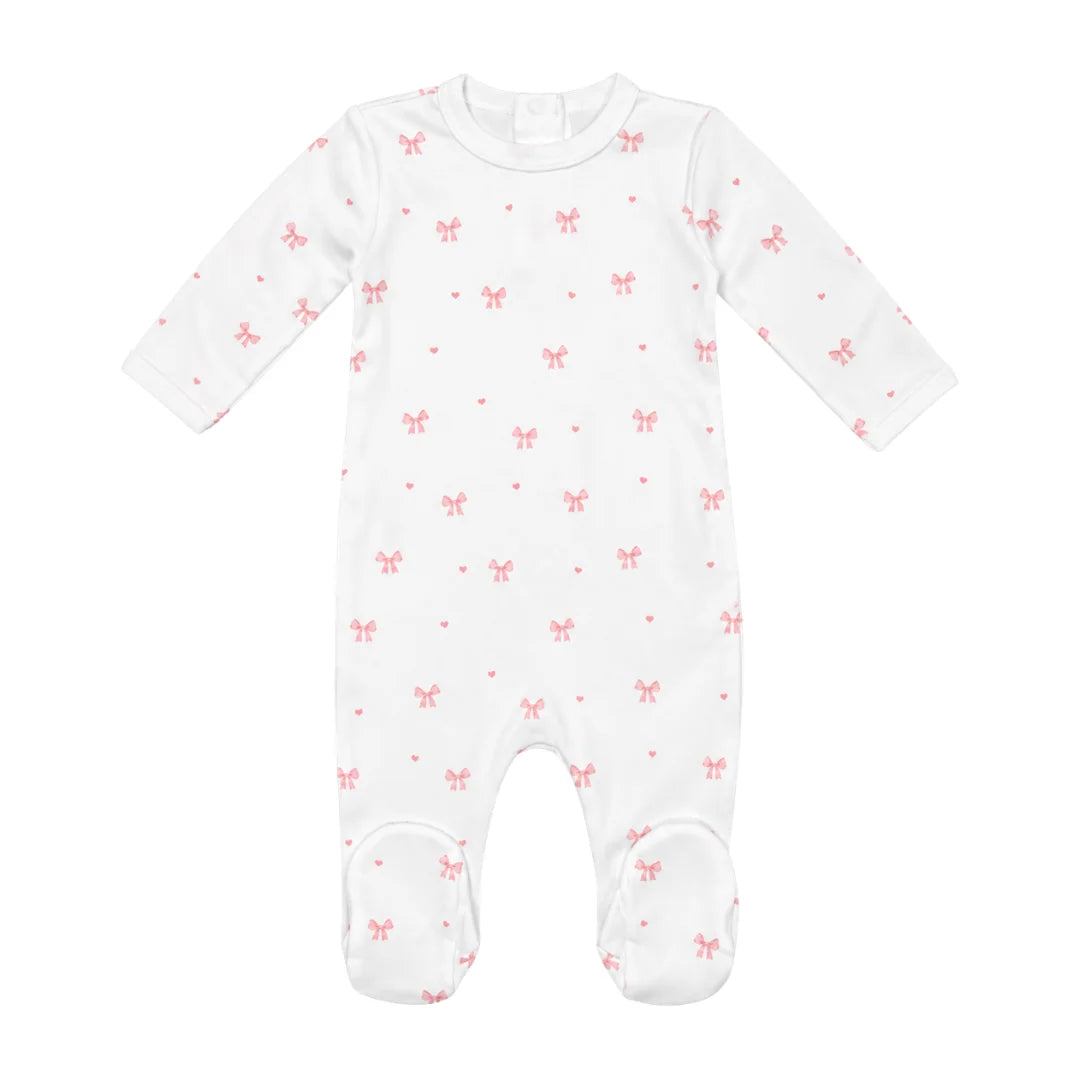 A flat-lay view of the Coton Pompom tinny luxlace footie in ivory.
