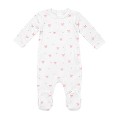 A flat-lay view of the Coton Pompom tinny luxlace footie in ivory.