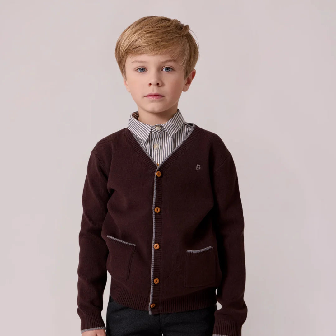 A stylish child wearing the Cottier brown cardigan