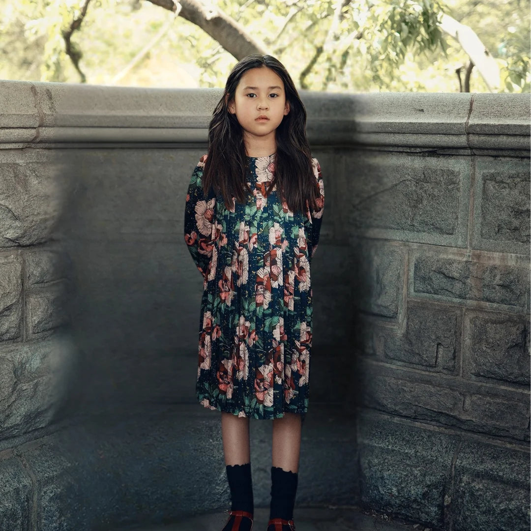 A child wearing the Cottier navy dress.