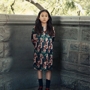 A child wearing the Cottier navy dress.