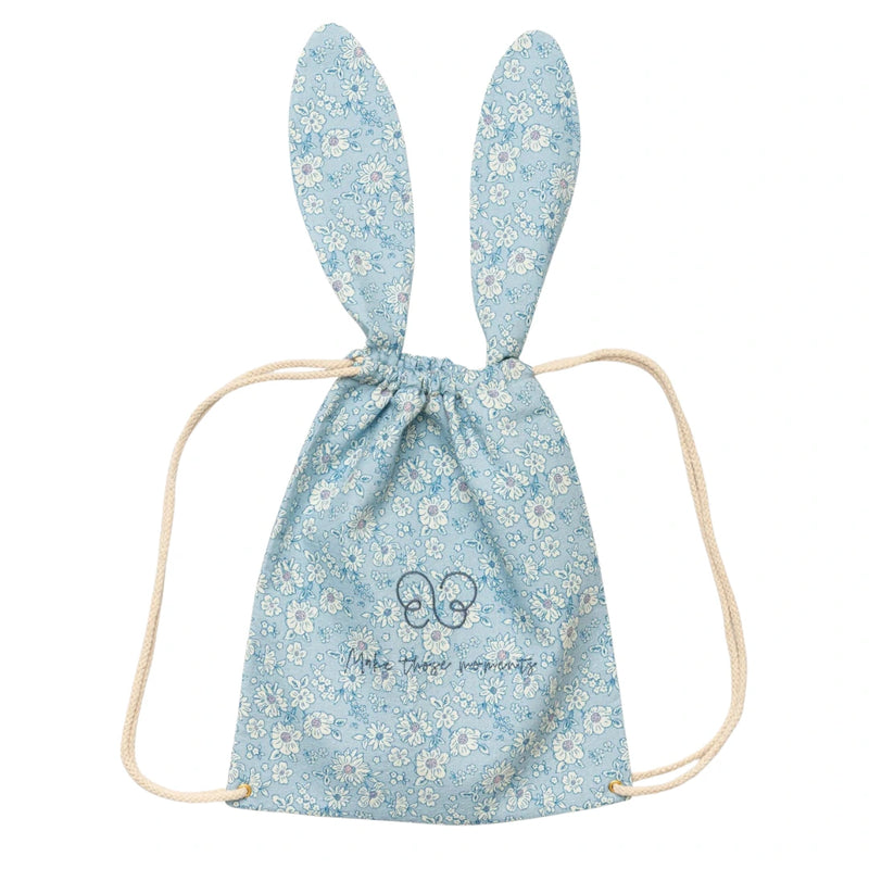 A breathtaking Early Sunday Bunny Drawstring Backpack in Tonal Floral Blue, showcasing its authoritative architectural ears and sophisticated SS26 botanical print.