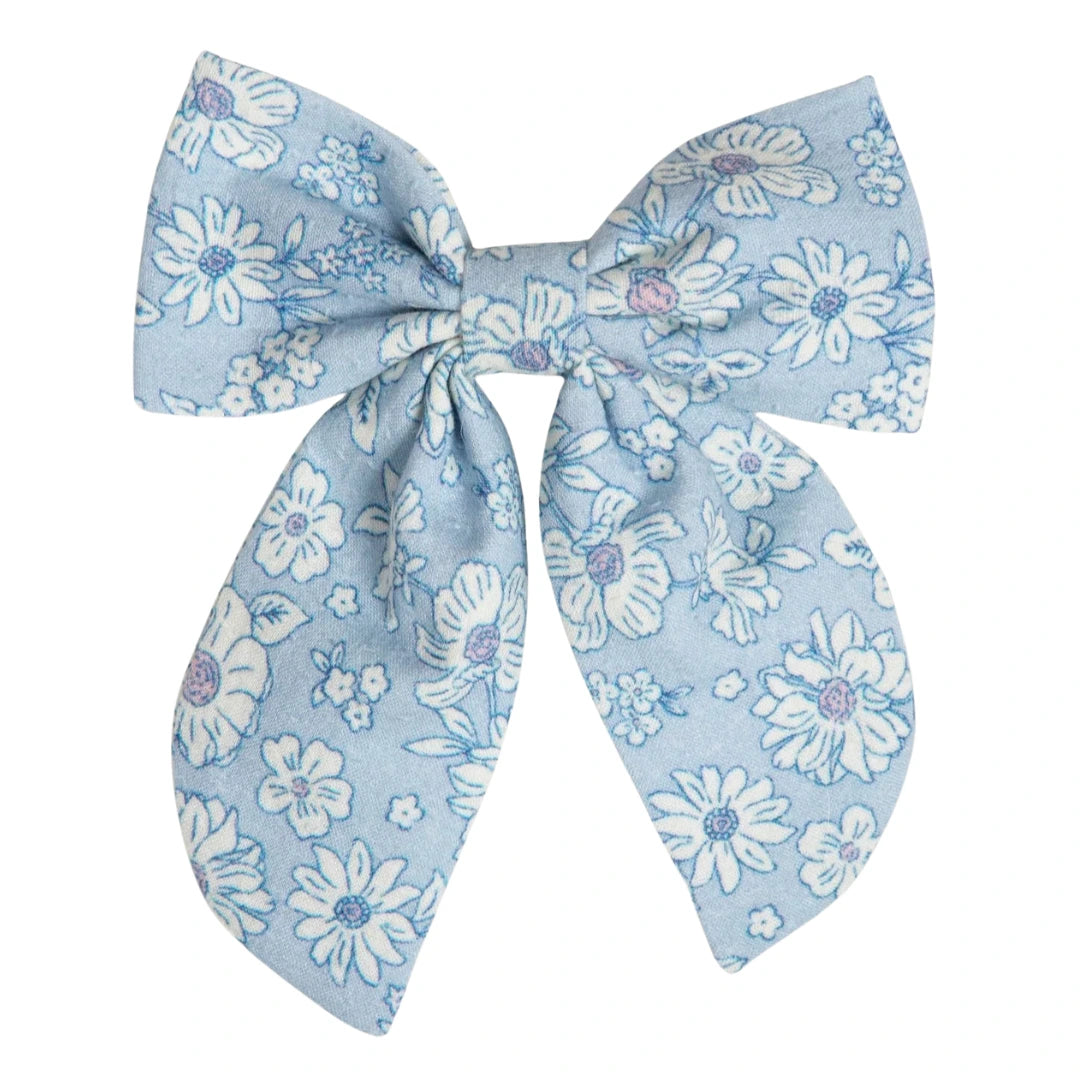 A breathtaking Early Sunday Floral Ditsy Bow Hair Clip from the SS26 collection, featuring a sophisticated botanical print and an authoritative architectural silhouette.