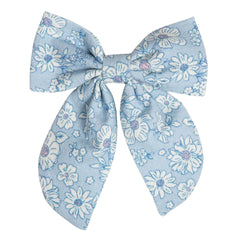 A breathtaking Early Sunday Floral Ditsy Bow Hair Clip from the SS26 collection, featuring a sophisticated botanical print and an authoritative architectural silhouette.