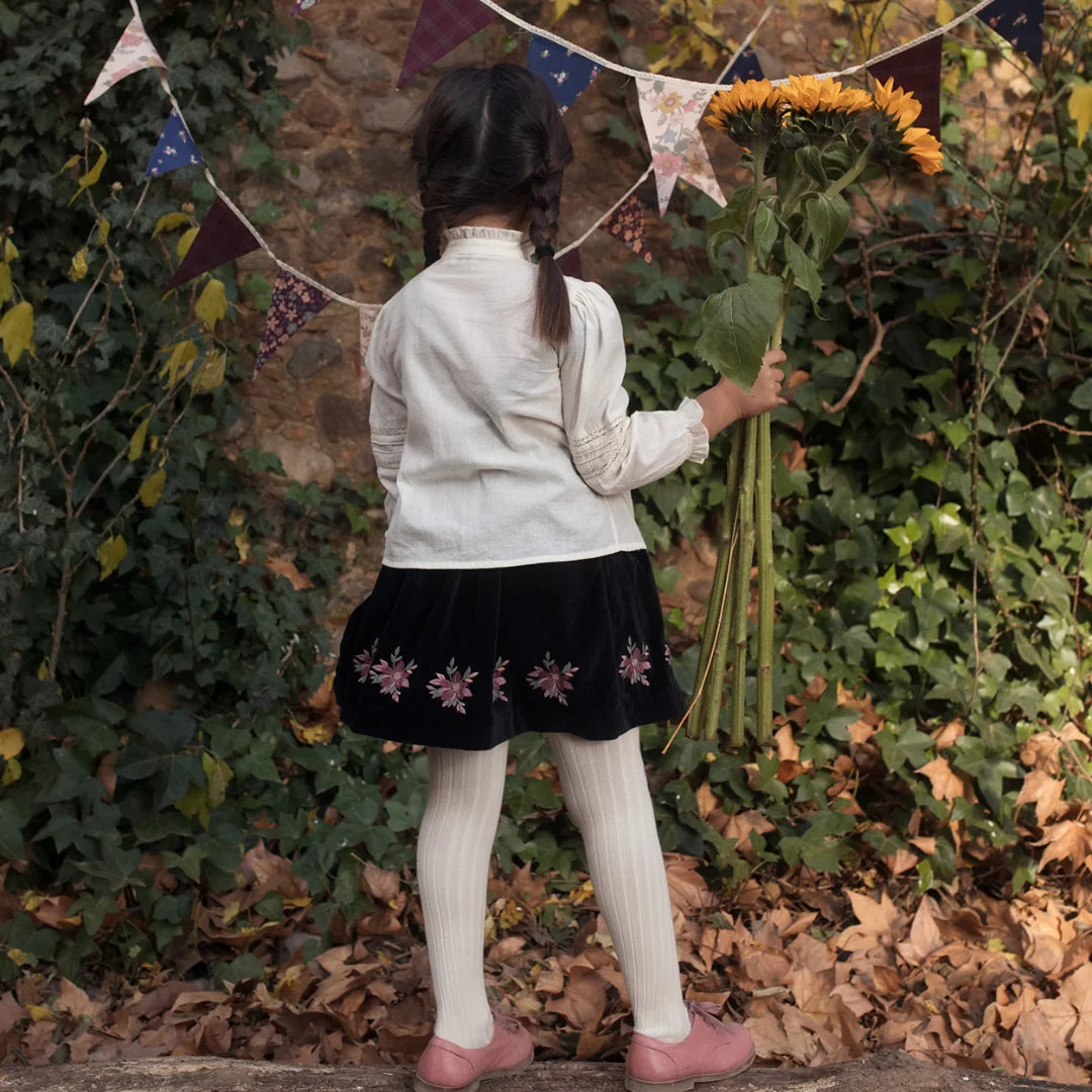 The clean back view of the luxury children's tailored blouse.