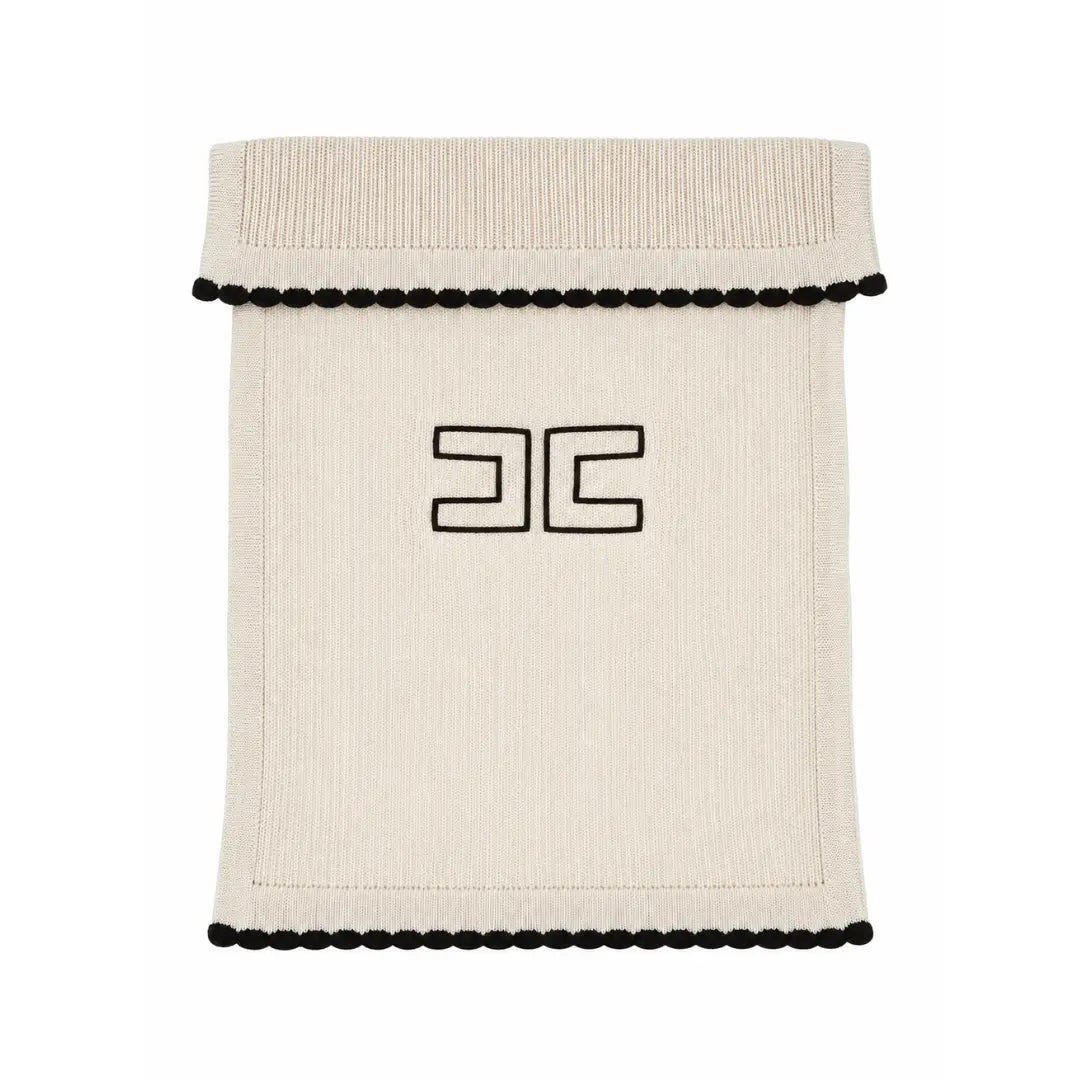 A flat-lay view of the Elisabetta Franchi English knit blanket in butter and black with border.