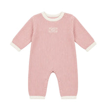 A flat-lay view of the Elisabetta Franchi English knitted romper in pink and ivory with edges.