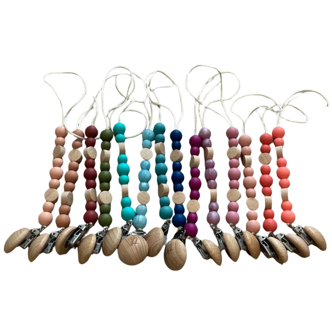 Set of colorful baby teething necklaces with wooden and silicone beads on a white background