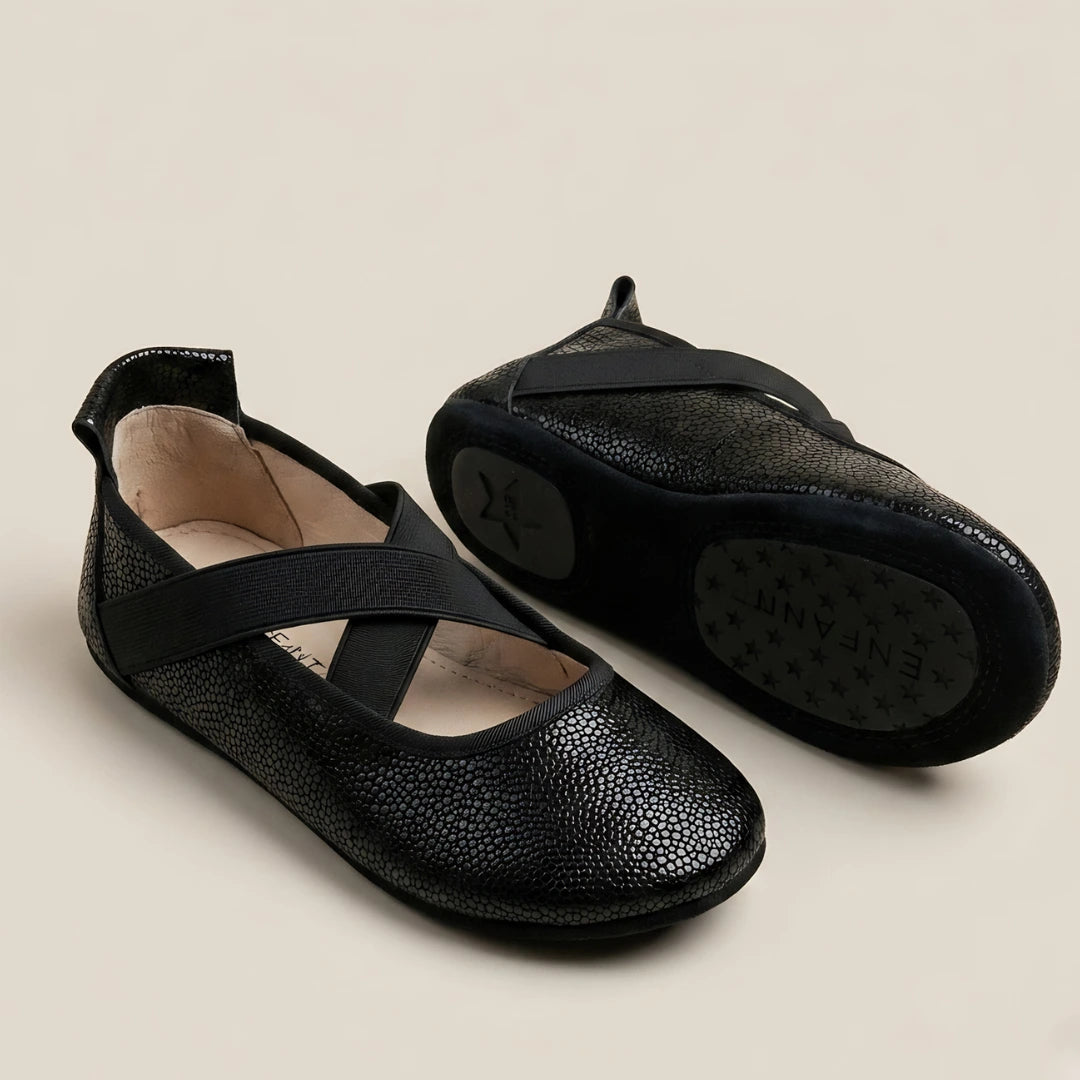 A breathtaking pair of EN FANT Black Leather Ballet Shoes, showcasing their authoritative architectural silhouette and refined, butter-soft onyx leather texture.